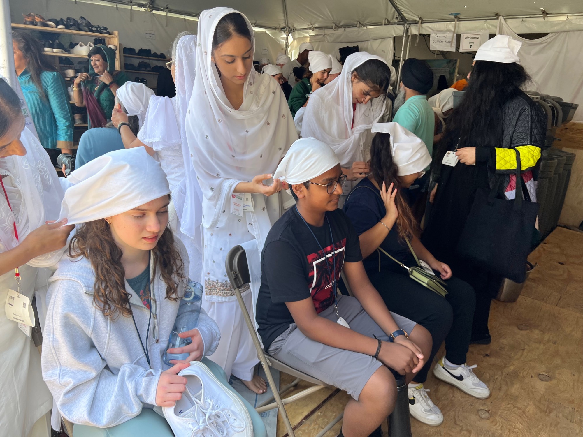 Students given head coverings for langar meal